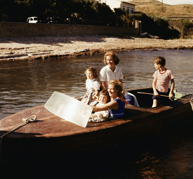 Ingrid Bergman drives a motor boat with her son, Roberto Rossellini Jr.; the twins, Isabella and Isotta Rossellini; and her eldest daughter, Pia Lindström, in 1957