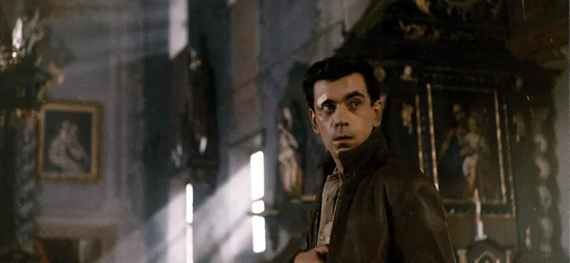 A man in a brown jacket.