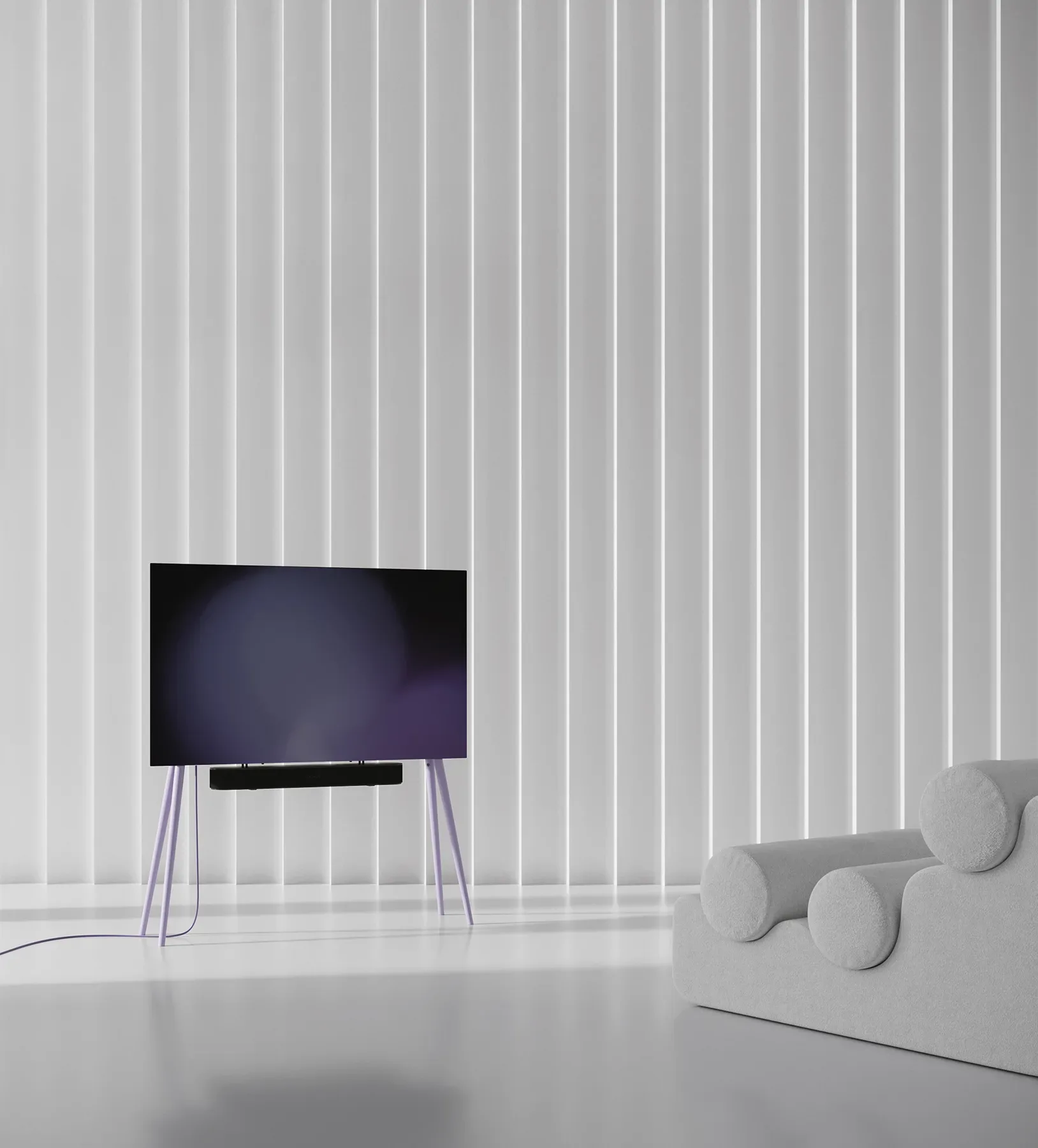 A minimalist tv stand stands in front of a white wall.
