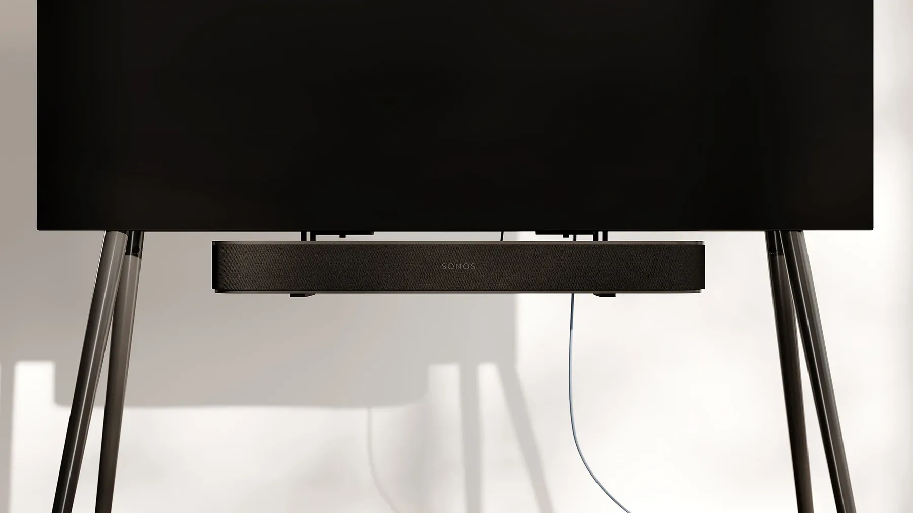 A minimalist tv stand with a tv on it.
